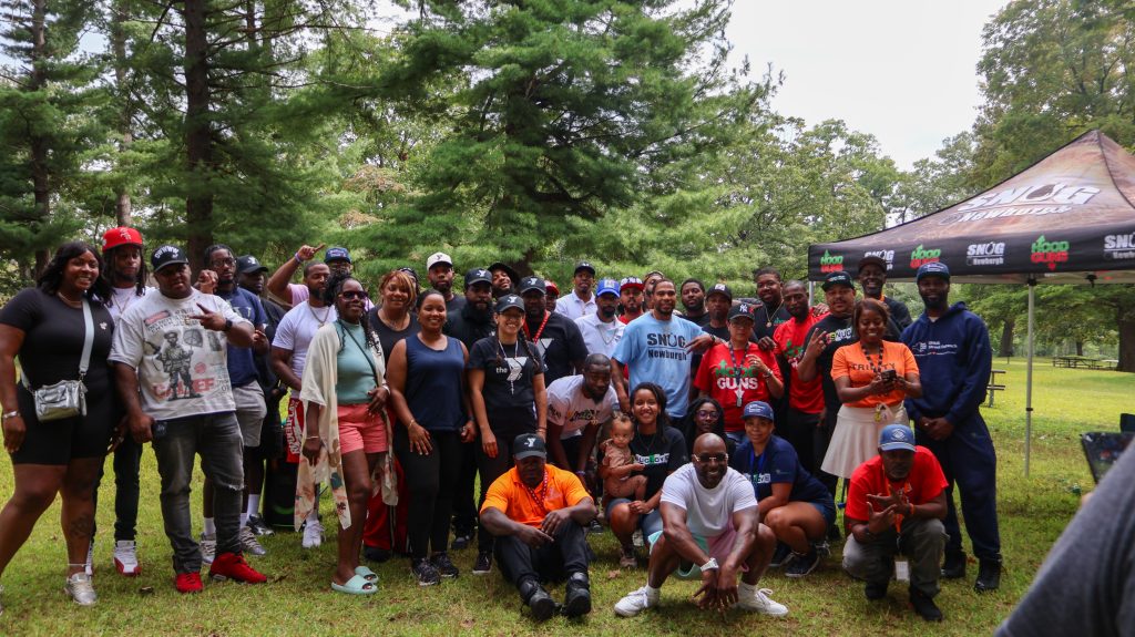 A group of people in a park as part of an event to prevent gun violence