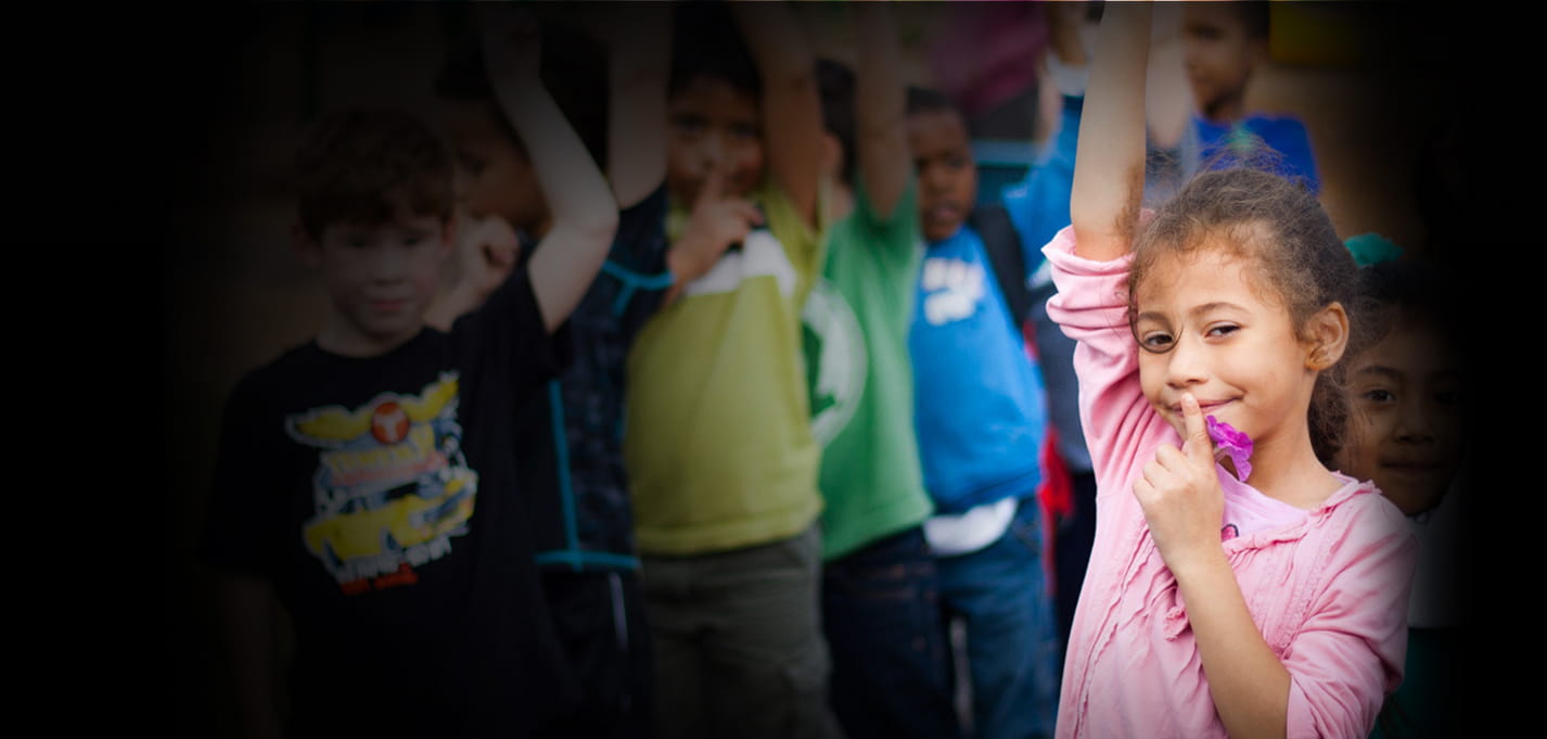 Family Services – child with arm in the air